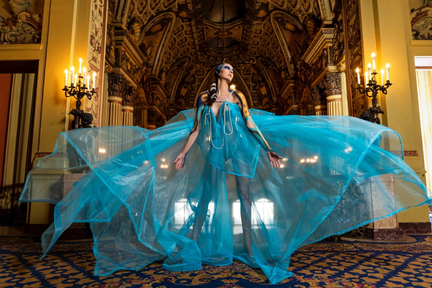 Jeff Linett fashion editorial portrait with sweeping blue fabric