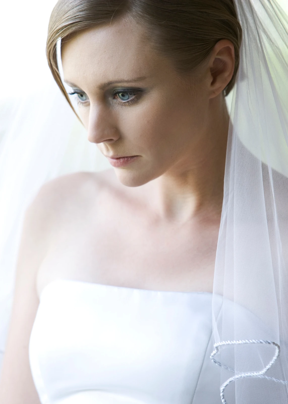 Softly lit bridal portrait by Jeff Linett