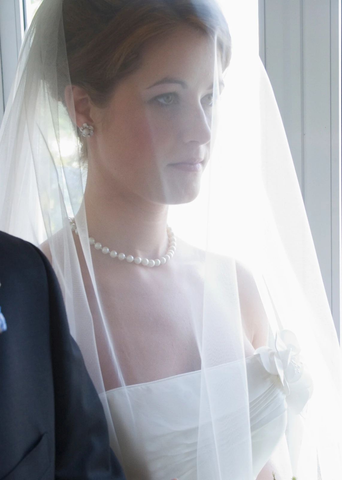 Bride in soft window light by Jeff Linett