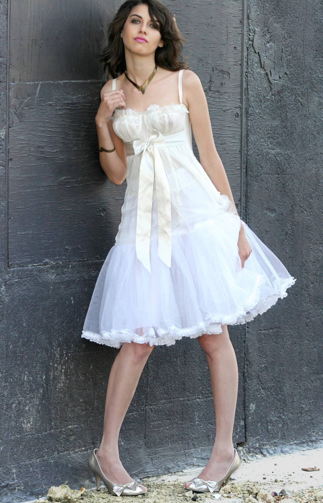 Bridal fashion portrait against a stone wall by Jeff Linett